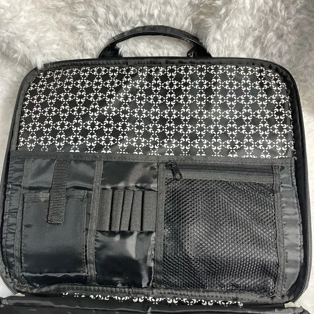 Black and white padded laptop bag with detachable padded shoulder strap